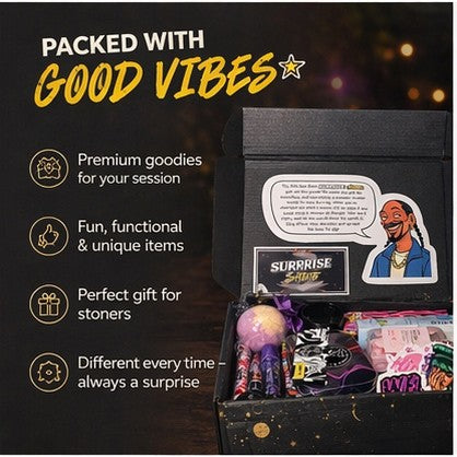 Surprise & Shine Snoop Box filled with rolling accessories, stickers, and fun items. Features Snoop Dogg graphic.